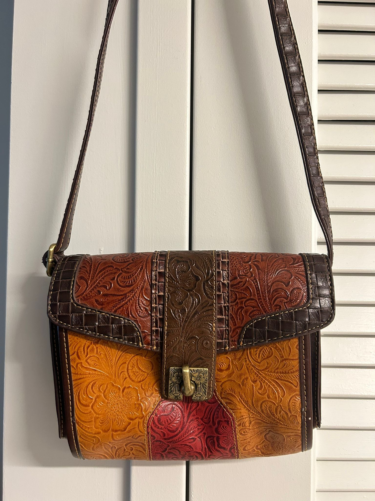 Tooled leather crossbody bag